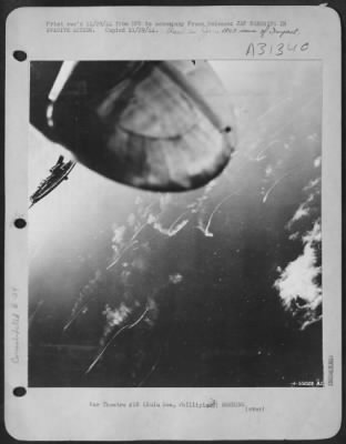 Consolidated > JAP WARSHIPS IN EVASIVE ACTION-Scattering wildly to escape bombs dropped by attacking U.S. Army 13th Air Force Liberators, 12 Japanese warships in a task force headed for the Philippines leave these minnow-like trails in the Sulu Sea