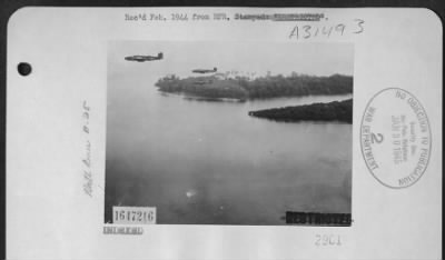 Consolidated > North American B-25 Mithcells over Gasmata Island, New Britain.