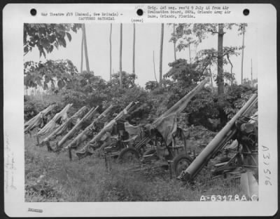 Consolidated > View showing Japanese anti-aircraft guns type 88, 75 mm along Simpson Harbor, Rabaul, New Britain. 8 November 1945.