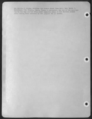 Consolidated > Lt. Marvin C. Hughes receives the Purple Heart from Brig. Gen. Ennis C. Whitehead. Lt. Hughes, Baird, Texas, a navigator, was one of the American flyers who was rescued from under Japanese noses on New Britain Island after having been marooned in the