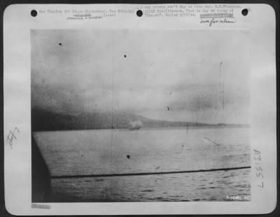 Consolidated > North American B-25 is just hitting water, as a result of LST gunfire on 26 Dec 43 off Cape Gloucester, New Britain.