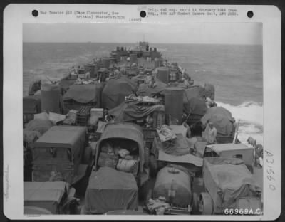 Consolidated > Piled high below and above decks with vital supplies for the Yanks of Gloucester, LSTs of the United States Coast Guard and Navy plow through the waters of the Vitiaz Strait on the vital supply lanes from Cape Sudest, New Guinea to Cape Gloucester