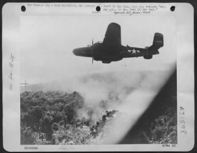 Consolidated > One of the General Kenney's B-25's (Billy Mitchell) bombers in action against Japanese installations on Cape Gloucester just before the landing of American Marines on the Japanese air base.