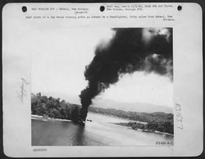 Consolidated > RAAF photo of a Jap barge burning after an attack by a Beaufighter, fifty miles from Rabaul, New Britain.