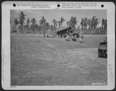 Thumbnail for Consolidated > American GI's add the finishing touches to the landing strip under construction at an airbase somewhere in the Philippine Islands.