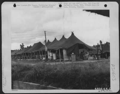Consolidated > General view of the tents and hospital area at Clark Field, Luzon, Philippine Islands. 27 June 1945.