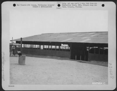 Thumbnail for Consolidated > Exterior view of a battalion mess hall at the 22nd Replacement Depot, Manila, Philippine Islands. Note that it has no screens. July 1945.