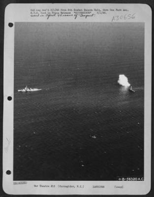 Consolidated > In spite of continued Naval shelling, Jap guns kept shooting. One of the near misses.