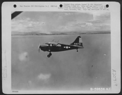 Consolidated > Vultee L-5 carrying litter patient to hospital from a forward strip. This is much smoother riding than a long trip over the road in an ambulance, but the important factor is speed, which means immediate and adequate medical attention.