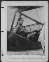 PRISON-BOUND NIP-this sadist-eyed Jap, a member of the garrison which murdered some 140 American prisoners of war, heads prisonward in the back seat of a Vultee L-5. He was captured in the fighting on Palawan Island, Philippine Islands. - Page 1