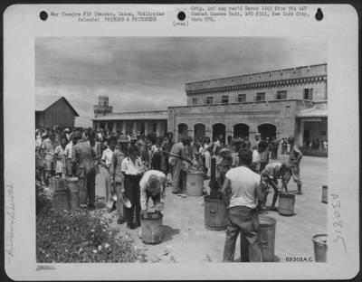 Thumbnail for Consolidated > At Bilibid Prison on Luzon, Philippine Islands, liberated prisoners are served their first square meal in over three years of Jap imprisonment.