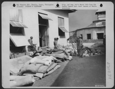Consolidated > Liberation forces clean filth ridden Bilibid Prison at Manila, Luzon, Philippine Islands. All furniture and bedding were burned and buildings were cleaned and fumigated and cleaned for housing of prisoners until they could be moved to a rear area.