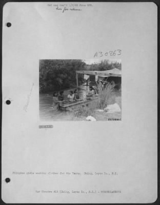 Thumbnail for Consolidated > Filipino girls washing clothes for the Yanks. Dulag, Leyte Is., P.I.