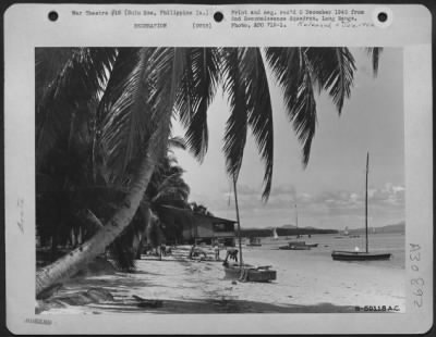 Consolidated > G.I.'s relaxing in the sun on the Sulu Sea beach. Philippine Islands. 21 October 1945.