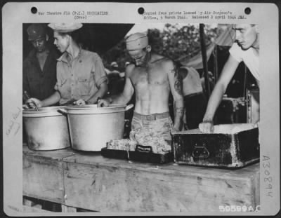Consolidated > GI chow ready to be dished out at this Air Force field kitchen in Manila, Philippine Islands, May 1945.
