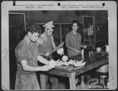 Consolidated > Preparing food in the Mess Hall of Company G, 863rd Engineer Battalion at Manila, Philippine Islands.