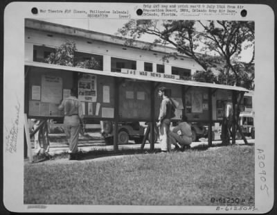 Consolidated > I and E War News Board of the 11th Special Services. This bulletin board keeps each soldier informed of current events that occur daily. Clark Field, Luzon, Philippine Islands. 1 June 1945.