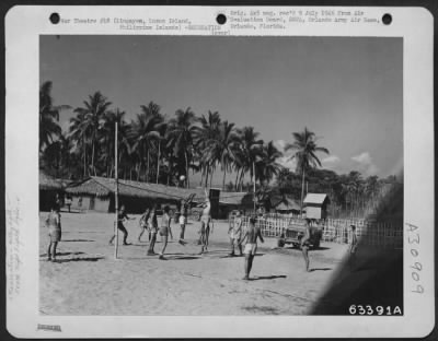 Consolidated > Men of the 547th Night Fighter Squadron at Lingayen play volley ball on this court in the squadron area. Physical exercise was stressed in this organization by the Special Services Officer for all crew members and squadron personnel. 1945. Luzon