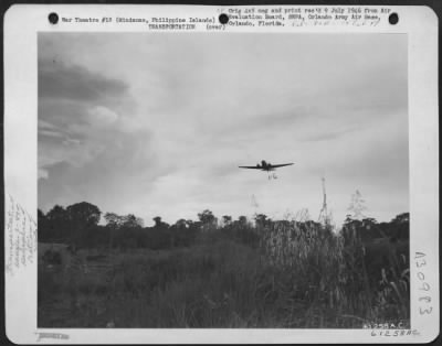 Consolidated > Rations being dropped from Douglas C-47 "Skytrain" over Kibawe Airstrip. 31st Division was supplied with rations for a period of two weeks by this means, due to all bridges being burned out and the impassability of roads. Provisions dropped with
