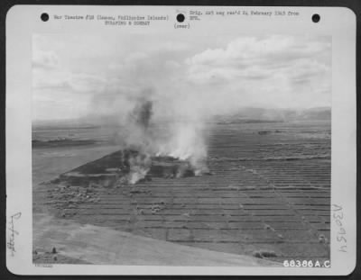 Consolidated > Jap planes burn furiously at Clark Field, Luzon, Philippine Islands. They were strafed by a North American P-51 during the fierce air and ground battle to regain control of the field.
