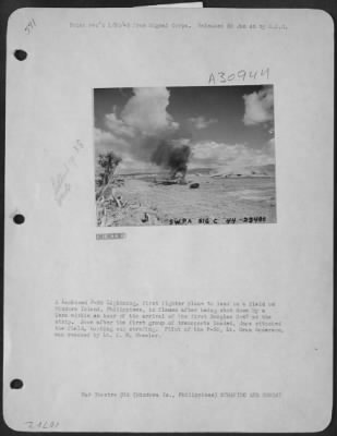 Consolidated > A Lockheed P-38 Lightning, first fighter plane to land on a field on Mindora Island, Philippines, in flames after being shot down by a Zero within an hour of the arrival of the first Douglas C-47 at the strip. Soon after the first group of transports