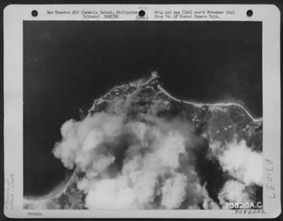 Consolidated > Bombs, dropped by Consolidated B-24s of the 494th Bomb Group, burst on the target-Jap gun positions on Caballo Island in the Philippines in February 1945.