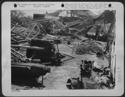 Consolidated > Remains of equipment in a Japanese machine shop, after Allied bombing and strafing attacks. Silut Lagoon, Cebu Island in the Philippines. March 1945.