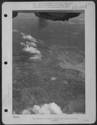 Consolidated > Bombs released by Consolidated B-24 Liberators of the 866th and 867th Bomb Squadrons, 494th Bomb Group, fall toward airdrome on Cebu Island in the Philippine Islands. 6 December 1944.