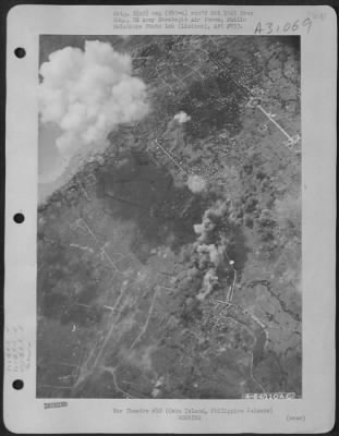 Consolidated > Bombs dropped by Consolidated B-24 Liberators of the 866th and 867th Bomb Squadrons, 494th Bomb Group, explode on airdrome on Cebu Island in the Philippine Islands. 6 December 1944.