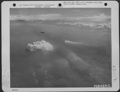 Consolidated > Both the Navy and Air Force participated in the attack on Corregidor and Caballo Island in the Philippines, on 14 February 1945. Here, the bombs, dropped by Consolidated B-24 "Liberators" of the 494th Bomb Group, burst on the target as ships lying in