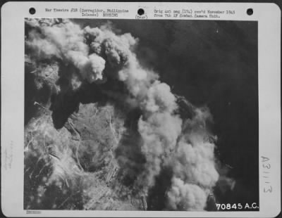 Consolidated > Bombs, dropped by Consolidated B-24 "Liberators" of the 494th Bomb Group, burst on the target at Corregidor in the Philippine Islands on 14 March 1945.