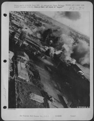 Consolidated > Medium, attack, and fighter planes attacked enemy railway installations and motor columns today in southeastern Luzon, bringing their total score to 26 locomotives destroyed, 300 freight cars, and more than 400 vehicles. Photo shows smoking railroad