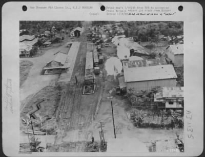 Thumbnail for Consolidated > Photo shows parachute bombs, used in low level bombing, falling on Jap railroad installation in southeastern Luzon. More than 300 freight cars and 26 locomotives have been destroyed in this area to date by air force activity.