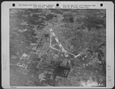 Consolidated > Bomb craters on the runway at Lipa Airfield, Luzon in the Philippine Islands, make it impossible for the Japanese to use the strip. 14 February 1945.
