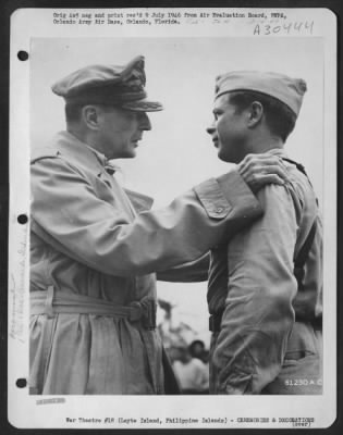 Consolidated > On An Airstrip On Leyte Island, Philippine Islands, General Douglas Macarthur Congratulates Major Richard Ira Bong, Whose 38 Victories Make Him America'S Top Fighter Pilot, After Awarding Him The Congressional Medal Of Honor.