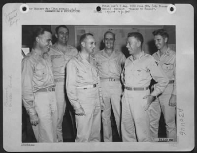 Thumbnail for Consolidated > Planners Of The Air War Against Japan, Smile Appreciatively As Brig. Gen. Donald R. Hutchinson Of Winter Park, Fla., Chief Of Staff Of The Far East A.F. (Third From Left) Is Awarded The Distinguished Service Medal By His Commander, Gen. George C. Kenney,