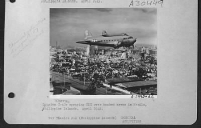 Consolidated > Douglas C-47S Spraying Ddt Over Bombed Areas In Manila, Philippine Islands.  April 1945.