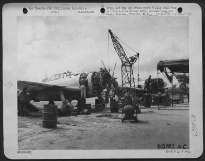 Consolidated > Mechanics Changing The Engine On A P-47 'Thunderbolt' Of The 201St Mexican Fighter Squadron.  Porac Airstrip, Philippine Islands - 26 June 1945.