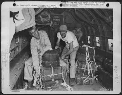 Consolidated > Members Of The 11Th Cargo Re-Supply Company Attaching Parachute To 30 Cal. Ammunition Boxes, Which Are To Be Dropped To Guerilla Troops Behind Japanese Lines.  Douglas C-47 "Skytrains" Usually Carries From 4000 To 5000 Pounds On Such Missions.  Normally,