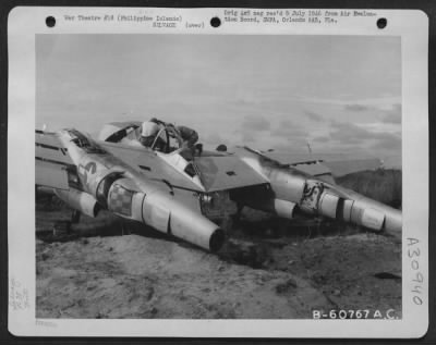 Consolidated > Mechanics Of The 92Nd A.S.S. Salvage Parts For Landing Gear Selector Valve To Be Used In Another P-38 'Lightning'.  Salvage Depot, Clark Field, Luzon, Philippine Islands - 25 June 1945.