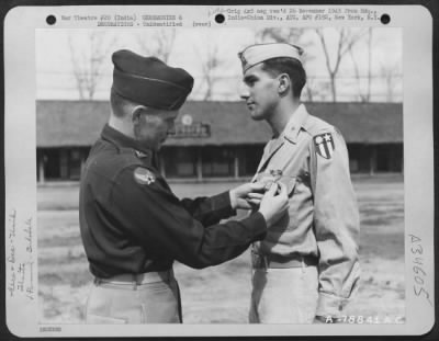 Thumbnail for Consolidated > An Officer Presents The Distinguished Flying Cross To A Member Of The 1330Th Aaf Base Unit, Air Transport Command, During A Ceremony At An Airbase At Jorhat, Assam, India. 20 March 1945.