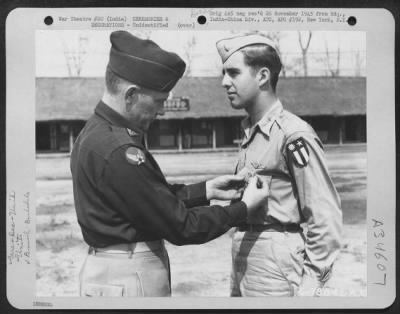 Consolidated > An Officer Presents The Distinguished Flying Cross To A Member Of The 1330Th Aaf Base Unit, Air Transport Command, During A Ceremony At An Airbase At Jorhat, Assam, India. 20 March 1945.