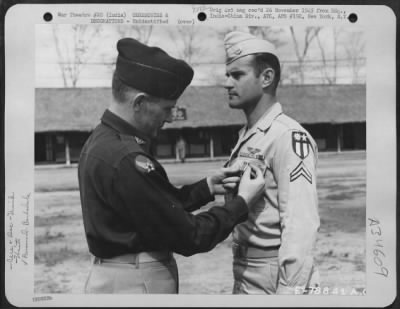 Consolidated > An Officer Presents The Distinguished Flying Cross To A Member Of The 1330Th Aaf Base Unit, Air Transport Command, During A Ceremony At An Airbase At Jorhat, Assam, India. 20 March 1945.