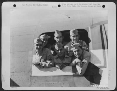 Thumbnail for Consolidated > Crew Members Of The Consolidated B-24 "Rangoon Rambler" Peer Out Of A Waist Window As Their Photograph Is Taken Before Leaving Pandaveswar, India For Home.