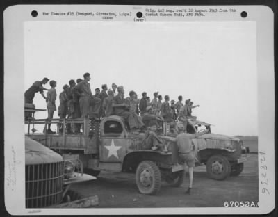 Consolidated > At an air base near Bengasi, Cirenaica, Libya, ground crews of the Ninth U.S. Air Force watch their flying buddies return from the Axis-shattering bombing raid on the Ploesti, Roumania oil fields and refineries, which virtually knocked out 35% of