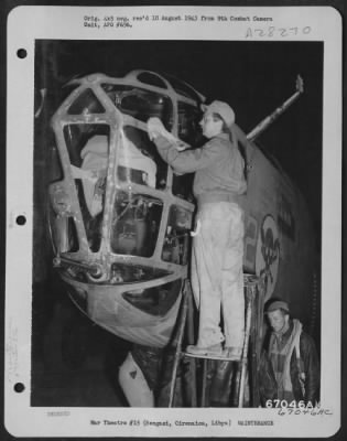 Consolidated > At an air base near Bengasi, Cirenaica, Libya, a ground crew member of the 376th Bomb Group cleans the plexi-glass nose of a Consolidated B-24 "Liberator" in preparation for the devastating raid on Ploesti, Roumania. American flyers laid delayed