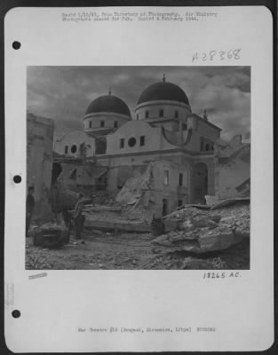 Thumbnail for Consolidated > All around Bengasi Cathedral, Cirenaica, Libya, there is widespread damage done by R.A.F. bombs during attacks on the harbor. But the building itself is not seriously damaged. Scars from flying masonry and bomb splinters are the only marks left