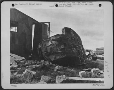 Consolidated > All that is left of a Junkers 52 troop carrier after Allied airmen bombed the administrative building and airdrome of an Axis position in Libya.
