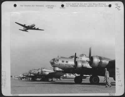 Consolidated > GOING HOME--Boeing B-17's, only a few months ago plaguing Naziland, line up at Marrakech, French Morocco, on their first step home. More than 2,500 bombers have flown through Marrakech, main channel of aircraft redeployment, since V-E Day.