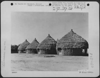 Consolidated > Marrakech, Morocco-For permanent personnel at Marrakech air base, these huts, built in native style, are comfortable and practical for Morocco which, in weather, is something like California. Note double-decker bed and pants getting an airing.